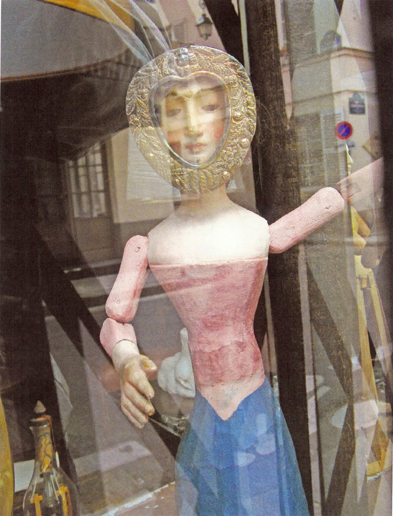 Heart Faced Doll Antique Store Window Paris, photograph by Roger Camp